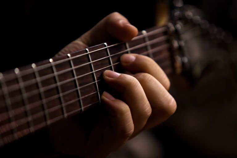 3 Benefits of a Low Action Guitar [& How to Adjust Your Action]