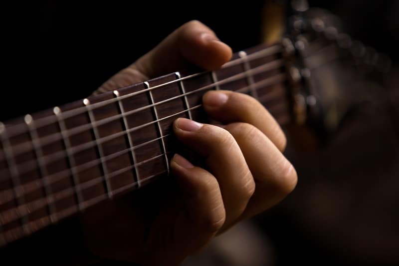 low action on acoustic guitar playing chords