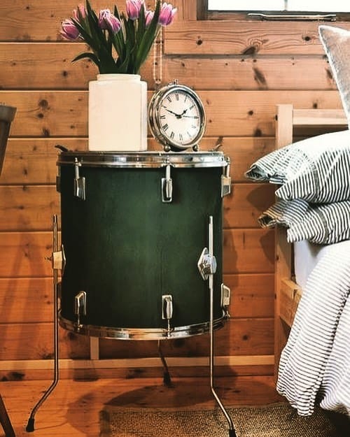 music room with drum as a nightstand